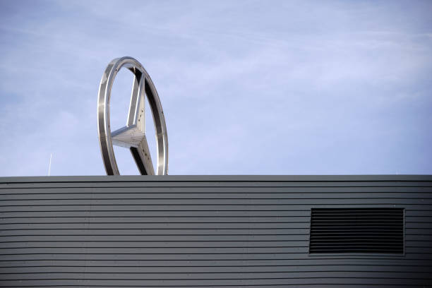 Mainz, Germany - March 10, 2017: The symbol and the shining star of Mercedes Benz on the roof of a car dealer on March 10, 2017 in Mainz.