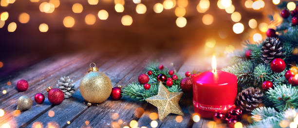 istock Red Candle With Christmas Decoration 884743556