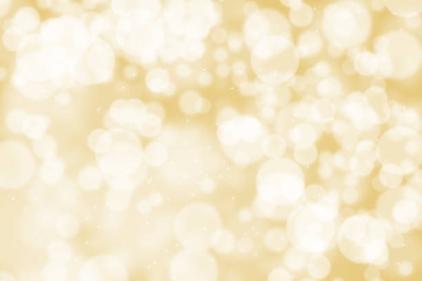 istock Abstract illustration bokeh light on golden background 884743588