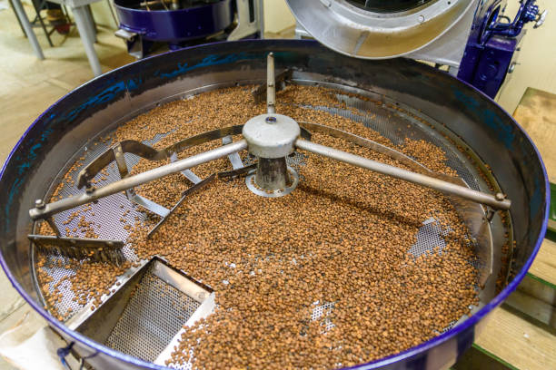 istock Coffee beans during the roasting process. Drum type roaster. Rosting process of coffee. 884758276