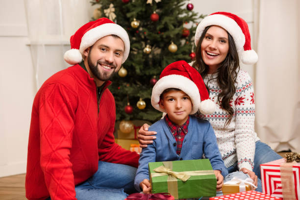 istock happy family with christmas presents 884759012