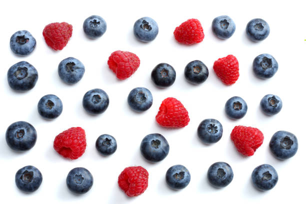 istock mix of blueberries, raspberries isolated on white background. top view with copy space 884764478