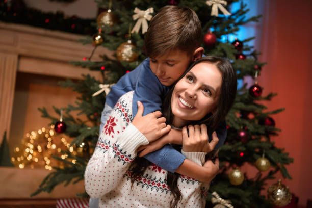 istock happy mother and son at christmas 884764998