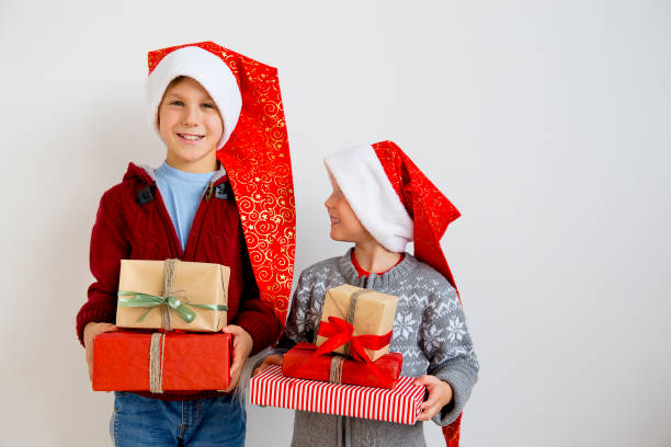istock Kids celebrating christmas 884771448