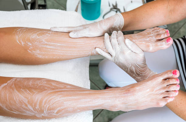 Foot treatment with cream. stock photo