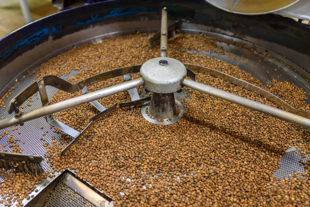 istock Coffee beans during the roasting process. Drum type roaster. Rosting process of coffee. 884776668