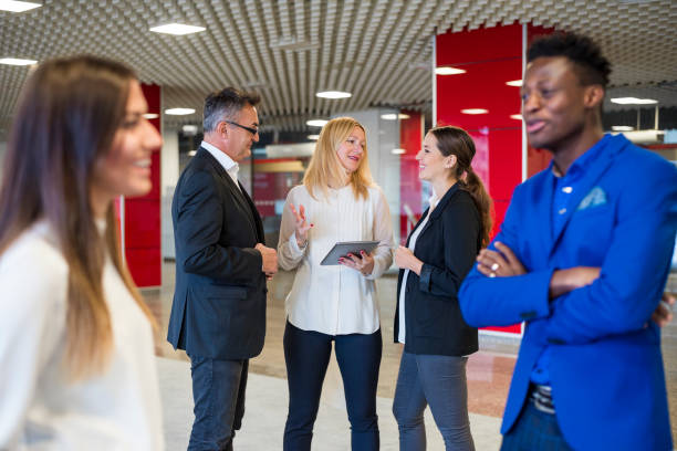 istock People in business center lobby 884780976