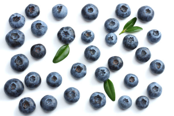 istock blueberries with green leaf isolated on white background. top view 884783106
