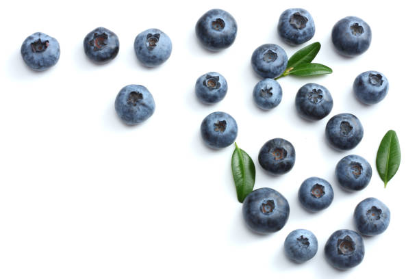 istock blueberries with green leaf isolated on white background. top view 884783120