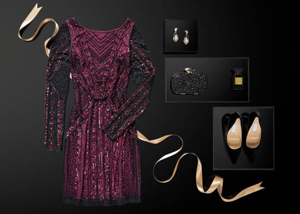 Sequin dress with personal accessories isolated on black background Sequin dress with personal accessories isolated on black background ( with clipping path) cocktail dress stock pictures, royalty-free photos & images