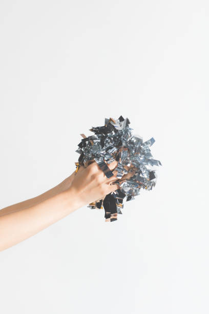 istock woman holding confetti in hands 884795668