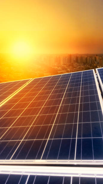 Solar Panel Photovoltaic installation on a Roof, alternative electricity source Solar Panel Photovoltaic installation on a Roof, alternative electricity source - Concept Image of Sustainable Resources solar panels on the roof of building in a city stock pictures, royalty-free photos & images