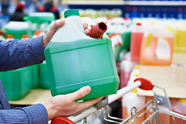 istock Man buys windshield washer fluid in shop 884806670