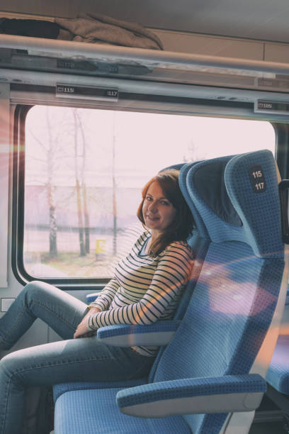 istock Caucasian woman traveling by train 884811024
