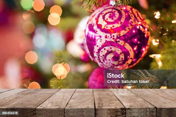Rustic Wood Table In Front Of Christmas Light Night Abstract Circular Bokeh Background Stock Photo - Download Image Now