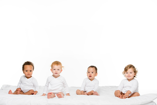 adorable multiethnic toddler boys and girls isolated on white