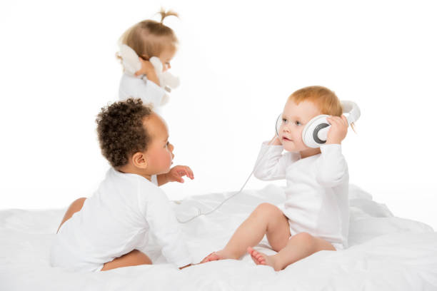 istock multiethnic toddlers with headphones 884816724