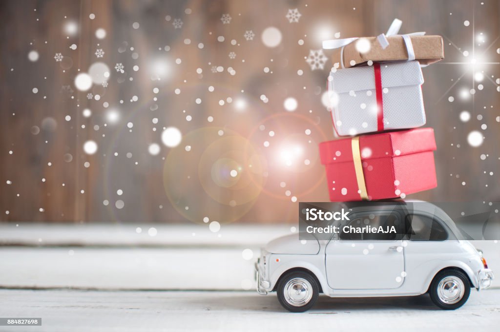 Christmas presents Gift boxes stacked on top of a retro car Car Stock Photo