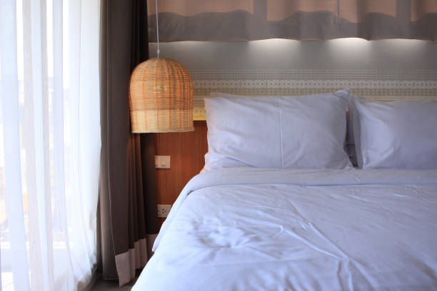 istock Bedroom with rattan lamp 884833668