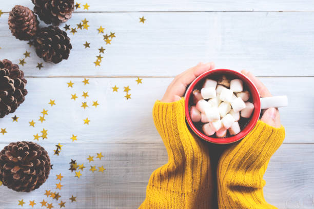 istock a cup of hot chocolate in woman hands 884834064