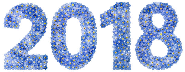istock Numeral 2018 from blue forget-me-not flowers, isolated on white background 884847678