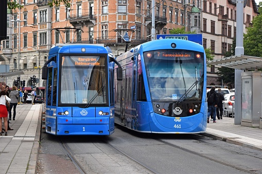 Stockholm, Sweden - 25th June, 2015: Trams on the street in Stockholm. On the left we see the Bombardier A34 tram and on the right: CAF Urbos 3 tram. The modern trams are a solution on the jams in crowded cities.
