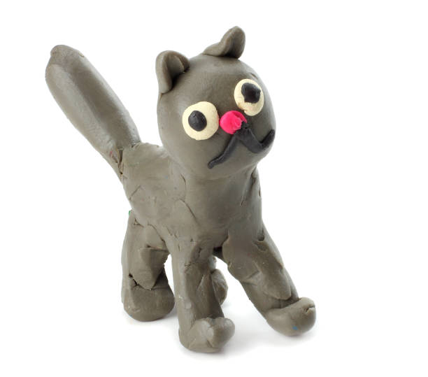 istock Kid's modelling clay cat isolated on white background 884855546