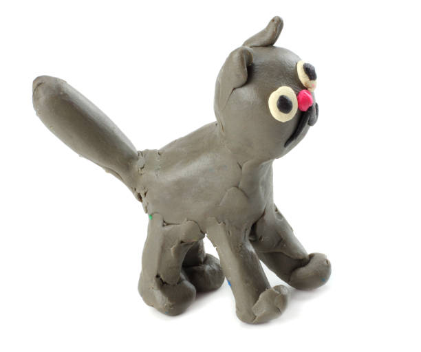 istock Kid's modelling clay cat isolated on white background 884855556