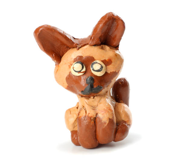 istock Kid's modelling clay cat isolated on white background 884855596