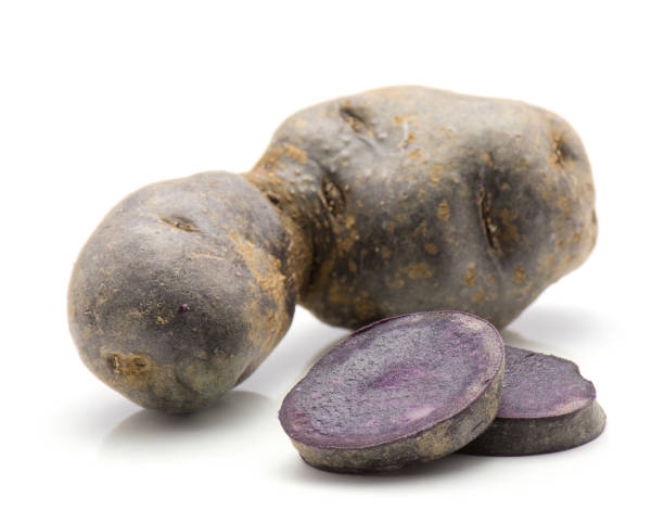 istock Vitelotte potato isolated 884855660