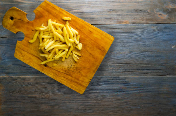istock fry potatoes on a wooden background 884862890