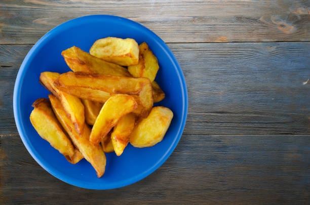 istock fry potatoes on a wooden background 884862916