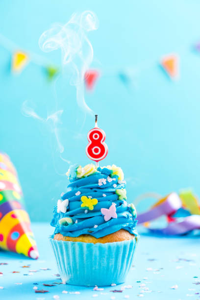 istock Eighth 8th birthday cupcake with candle blow out.Card mockup. 884868454