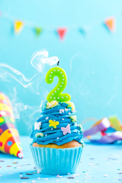 istock Second 2nd birthday cupcake with candle blow out.Card mockup. 884872300