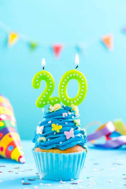istock Twentieth 20th birthday cupcake with candle. Card mockup. 884873572