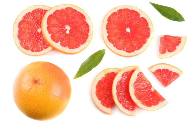 istock healthy food. sliced grapefruit with green leaf isolated on white background top view 884874162