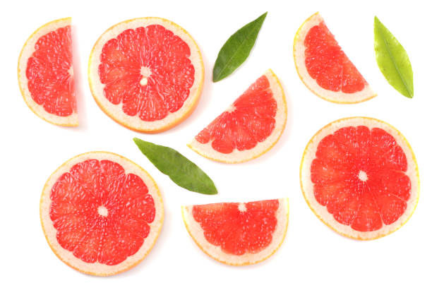 istock healthy food. sliced grapefruit with green leaf isolated on white background top view 884874188