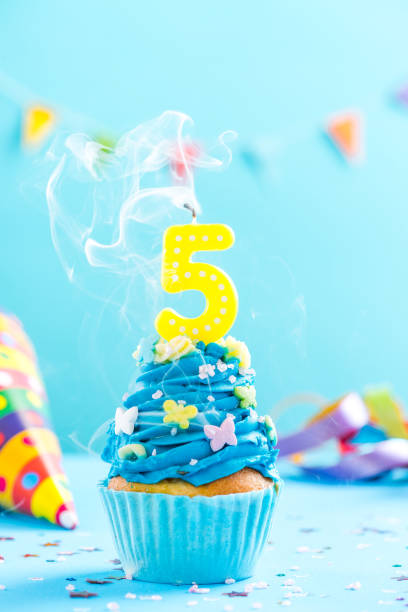 istock Fifth 5th birthday cupcake with candle blow out.Card mockup. 884880020