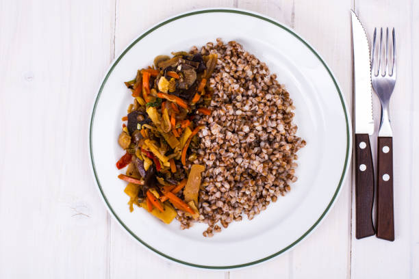 istock Boiled buckwheat with stewed vegetables 884881042