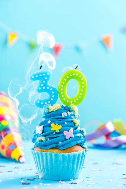 istock Thirtieth 30th birthday cupcake with candle blow out.Card mockup. 884887134