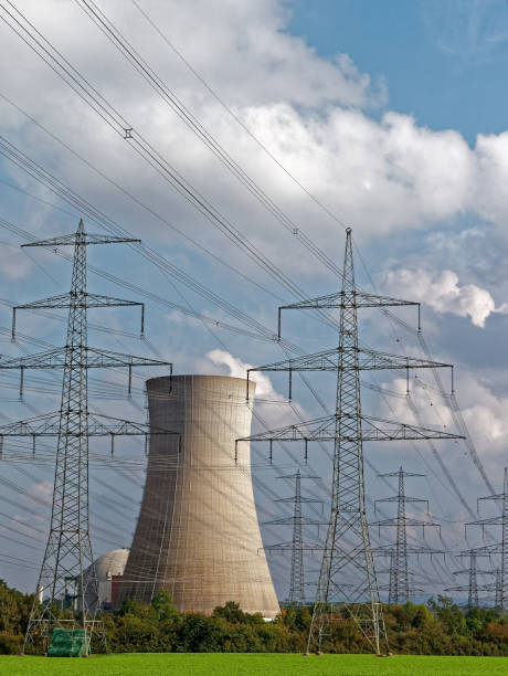 istock nuclear power station with electric power poles 884887596