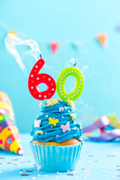 istock Sixtieth 60th birthday cupcake with candle blow out.Card mockup. 884892928