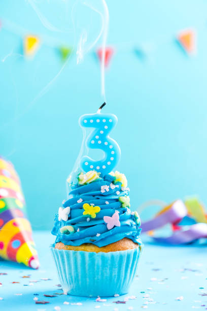 istock Third 3rd birthday cupcake with candle blow out.Card mockup. 884893028