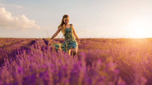 istock Endless love. Woman in lavender field at sunset. 884893076