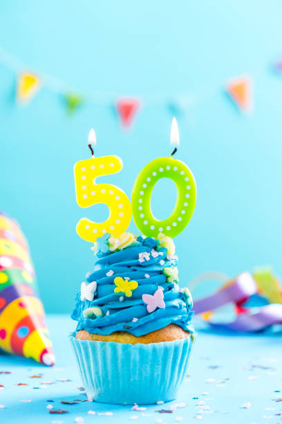 istock Fiftieth 50th birthday cupcake with candle. Card mockup. 884894080