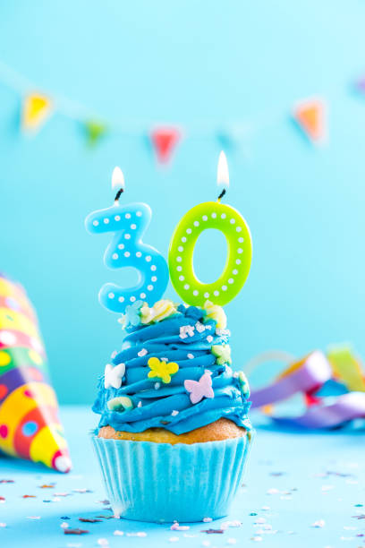 istock Thirtieth 30th birthday cupcake with candle. Card mockup. 884899656