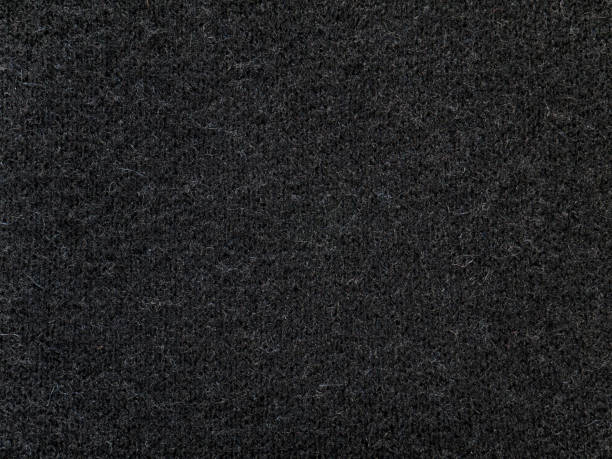 istock Black cashmere wool sweater knitted fabric texture 884902182