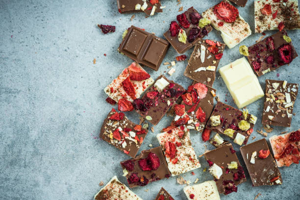istock Artisan handmade chocolate pieces,border background 884904644