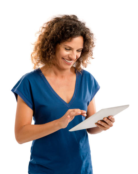 istock Happy woman working with a tablet 884932062