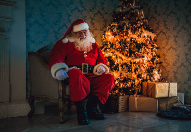 istock Santa sitting in a chair 884943112